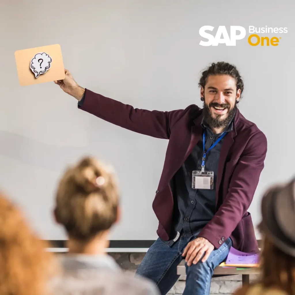 Professional presenting SAP Business One features to a group, highlighting its ERP benefits for small and medium-sized businesses.