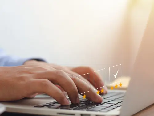 ands typing on a laptop, symbolizing seamless SAP  provided by Zconsulto for efficient operations