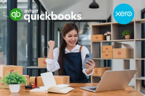 Business owner managing inventory with QuickBooks and Xero software in a modern office